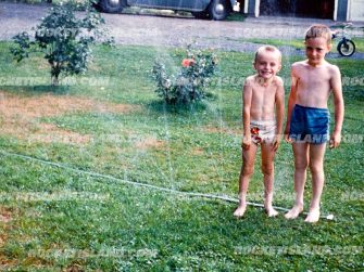 Two Boys in the Sprinklers